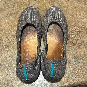 Very well loved gray croc tieks size 11